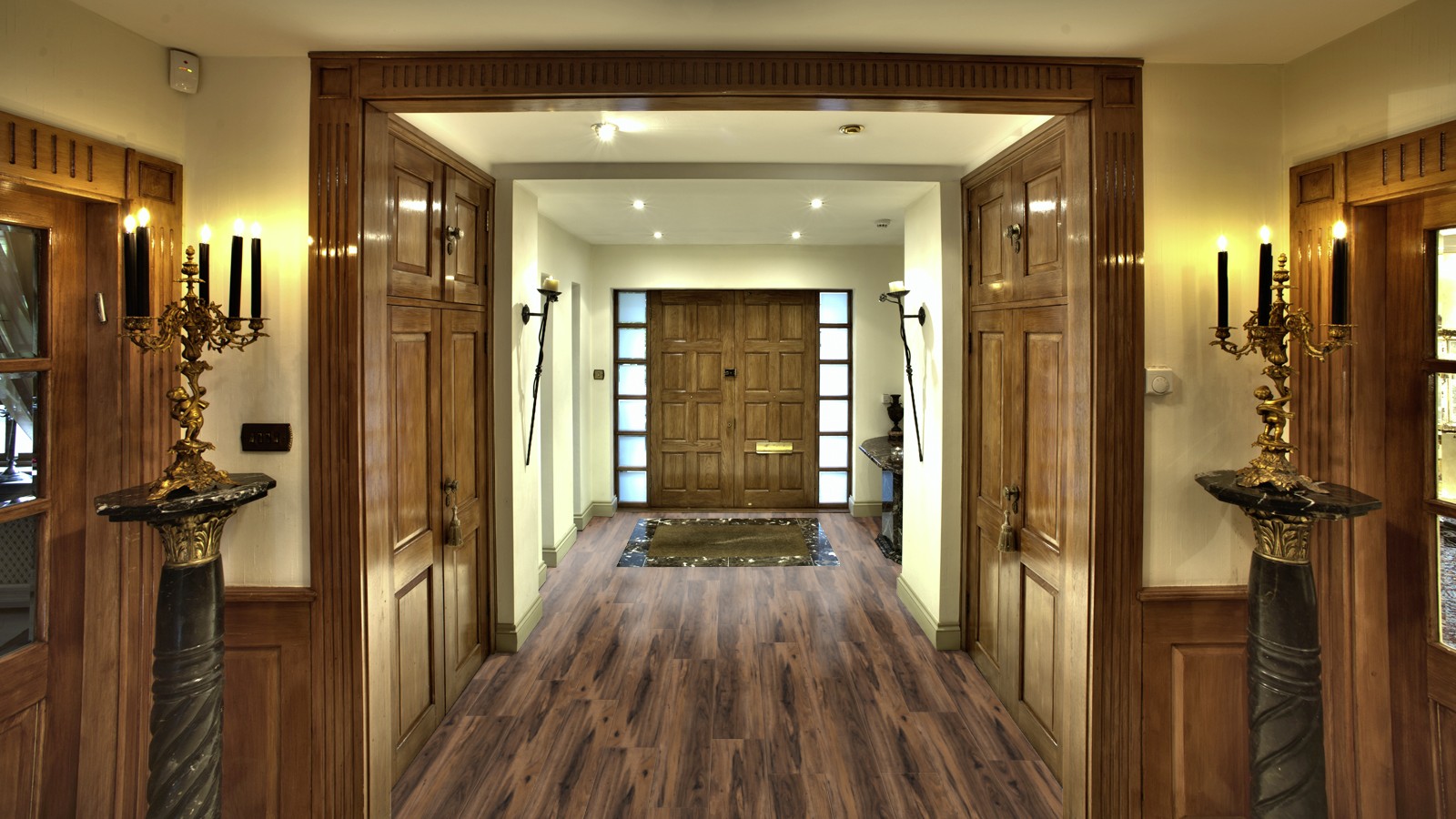 Excel Longplank Layla Walnut Hallway: A hallway featuring Pro-Tek™ Flooring's Excel Longplank in Layla Walnut, highlighting the rich wood tones and long plank design.