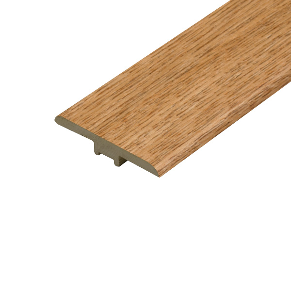 A detailed view of the Charlie Oak T-Profile, featuring a natural oak finish with visible wood grain. The profile is designed to create seamless transitions between floors of the same height, adding a touch of rustic charm.