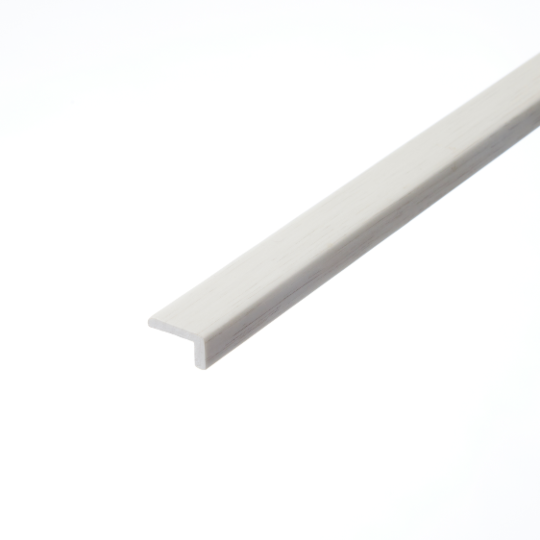 Bishops White L-Shape Profile: A detailed photograph of the Bishops White L-shape profile. This piece is characterized by its bright white colour and clean lines, suitable for providing a neat finish to the edges of flooring installations.